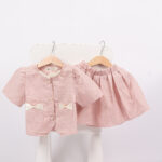 WD3514 طقم بلوزة وتنورة بفيونكات – وردي